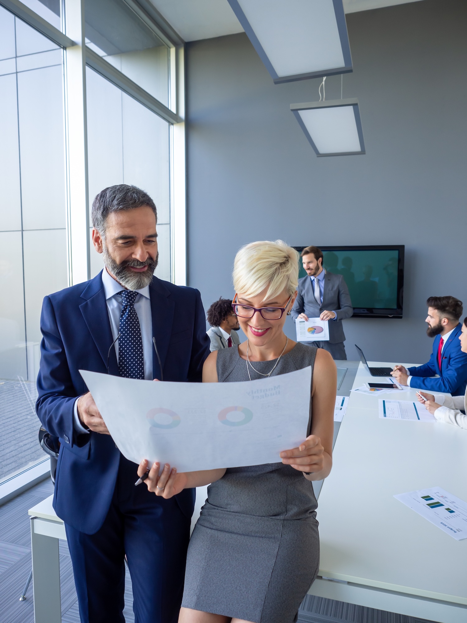 Collaboration and analysis by business people working in office